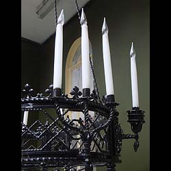 Antique wrought iron chandelier 
 This large and ornate Neo-Gothic Chandelier has ten branches and is made from Wrought Iron. An upper floral crown has downward twisted ropes with a decorative lower Oval section. 

