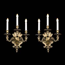 A pair of large Baroque style wall lights
