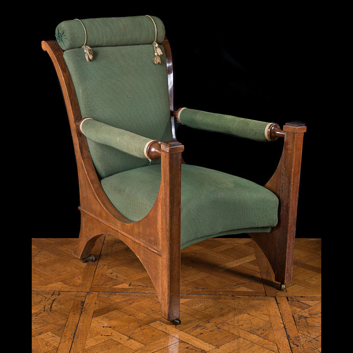 An Edwardian mahogany library armchair