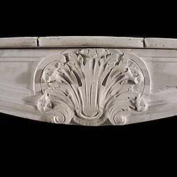 Antique Louis XV Stone Rococo Chimneypiece with fluted jambs 
 An antique Rococo Fireplace in the French style of Louis XV with a central cartouche, flanked by a panelled frieze, supported on fluted jambs. Carved in Stone.
